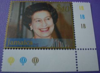 H.  M.  Queen Elizabeth 11 Wearing Pearls And Stripe Dress Jamaica Stamp photo